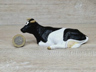 Schleich – 13211 Kuh schwarz/weiß, liegend