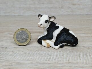 Schleich – 13639 Kalb Schwarzbunt, liegend