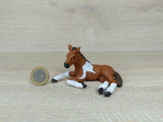 Schleich - Mc-D. Pinto Fohlen, liegend