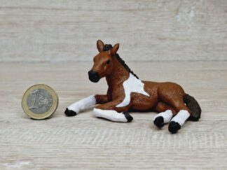 Schleich - Mc-D. Pinto Fohlen, liegend