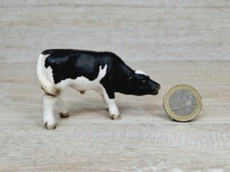 Schleich – 13615 Kalb Schwarzbunt, saugend