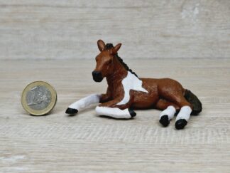 Schleich - Mc-D. Pinto Fohlen, liegend