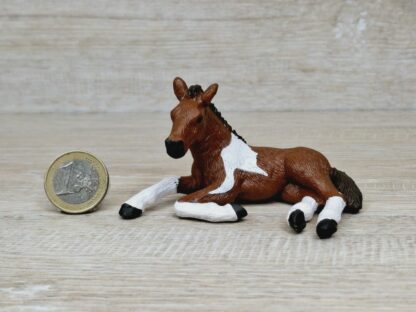 Schleich - Mc-D. Pinto Fohlen, liegend