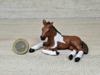 Schleich - Mc-D. Pinto Fohlen, liegend