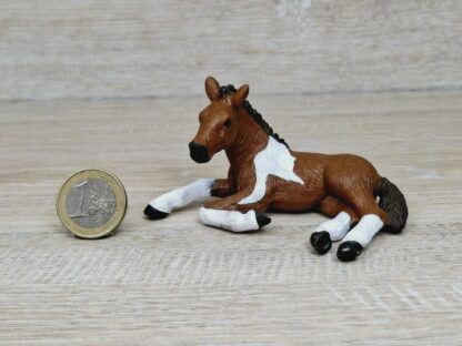 Schleich - Mc-D. Pinto Fohlen, liegend