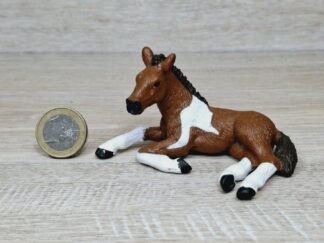 Schleich - Mc-D. Pinto Fohlen, liegend