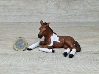 Schleich - Mc-D. Pinto Fohlen, liegend